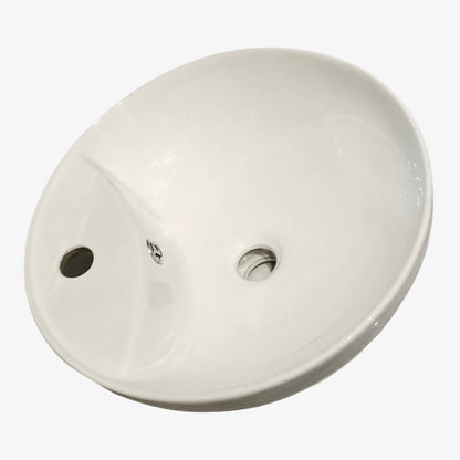 Round white ceramic sink on a white background